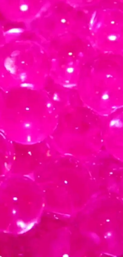 Vibrant pink bubble texture on mobile wallpaper.