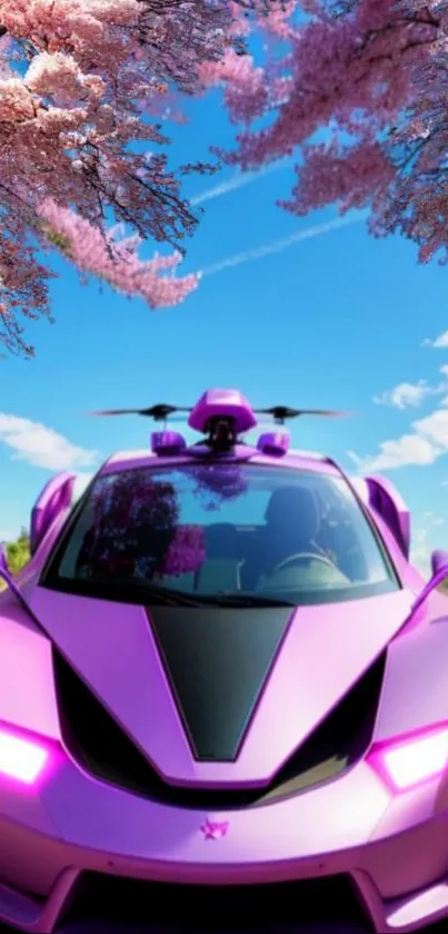 Pink futuristic car under cherry blossoms against a bright blue sky.