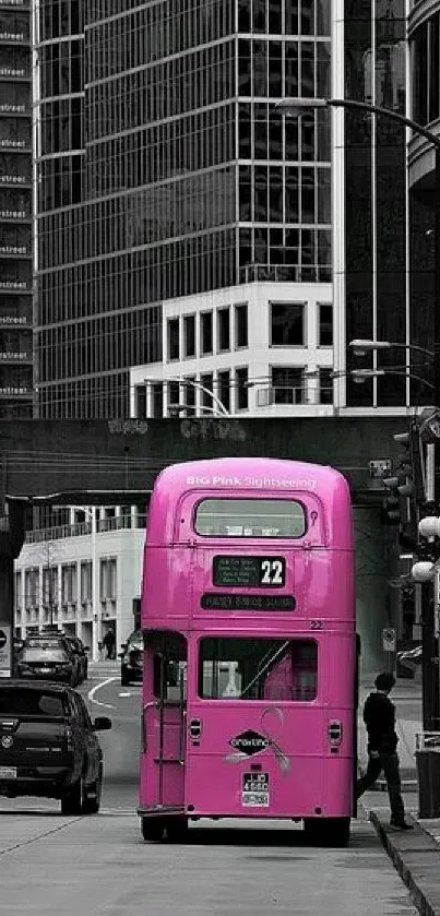 Pink double-decker bus in city street wallpaper.