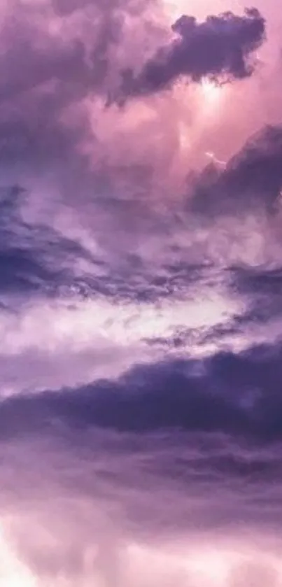 Vibrant pink and purple cloudy sky mobile wallpaper.