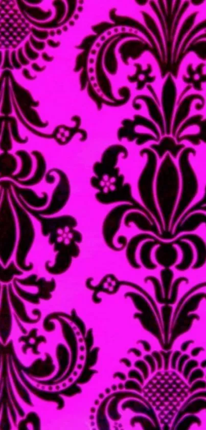 Vibrant pink damask wallpaper with intricate patterns.