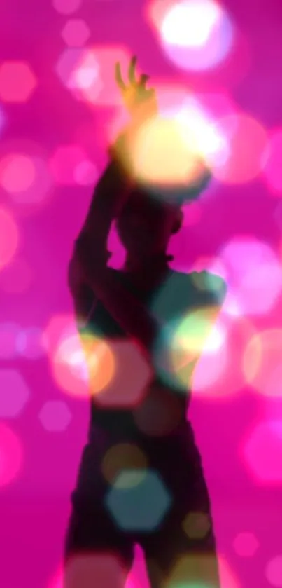 Silhouette of a dancer with pink bokeh lights in the background.