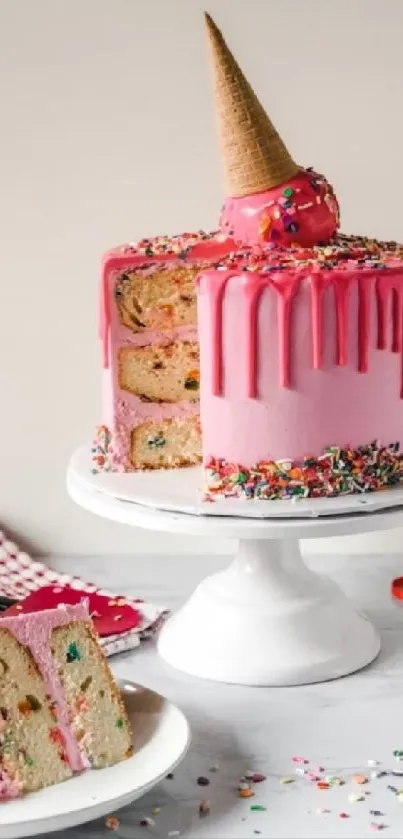 Pink drip cake with sprinkles and inverted ice cream cone.