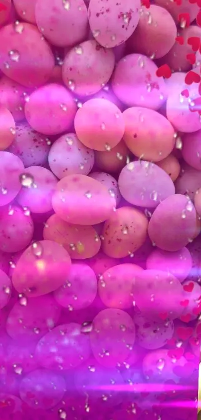 Vibrant pink eggs with heart patterns on wallpaper.