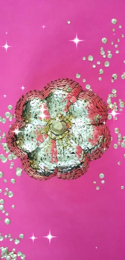 Vibrant pink wallpaper with sparkling sequin flower.