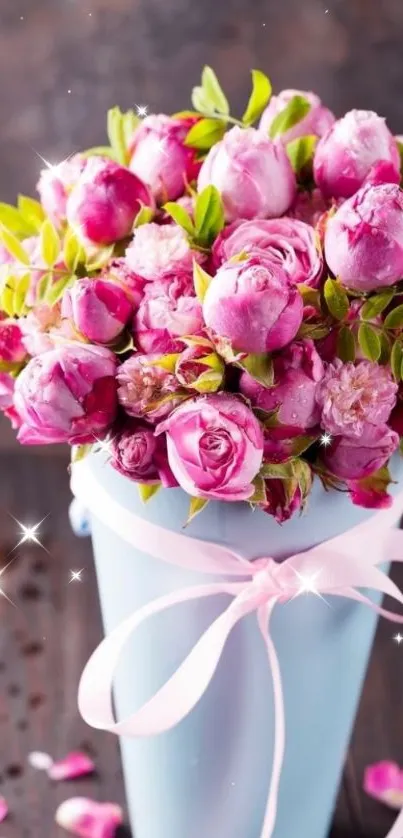 Vibrant pink roses in a blue vase with sparkles.