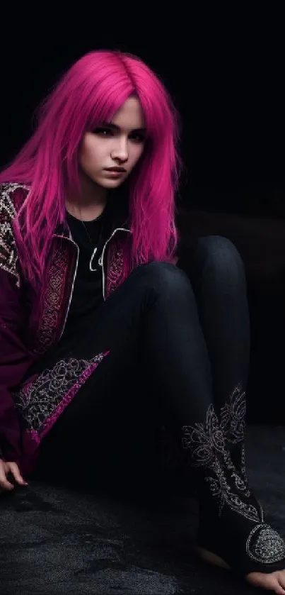 Girl with vibrant pink hair against a dark background, showcasing bold style.