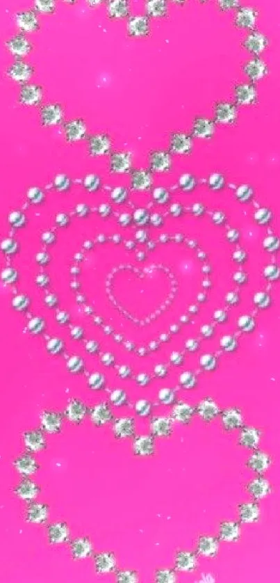 Vibrant pink mobile wallpaper with jewel-studded heart pattern.