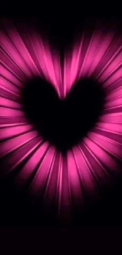 Vibrant pink heart glowing in the dark.