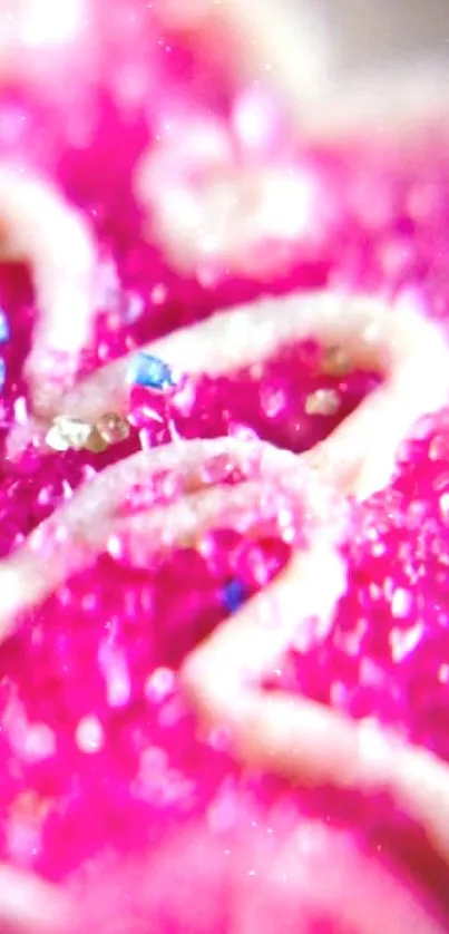 Close-up of vibrant pink heart-shaped sugar design on wallpaper.