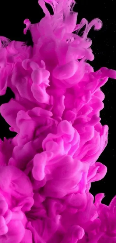 Vibrant pink ink splash on dark background.