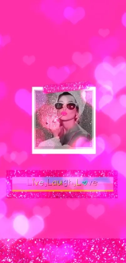 Pink wallpaper with 'Live, Laugh, Love' quote and stylish monochrome figure.