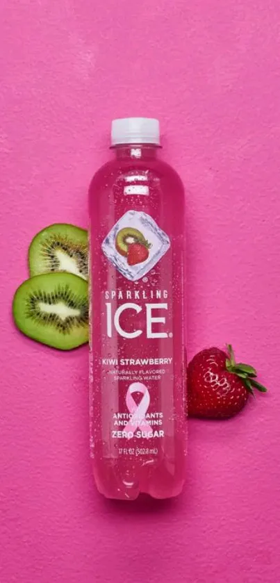 Kiwi strawberry sparkling drink on pink background with fruit slices.