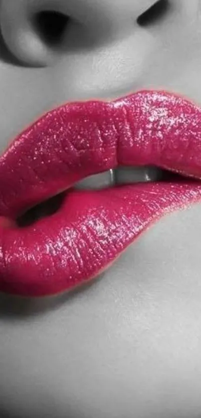 Striking black and white background with glossy pink lips.