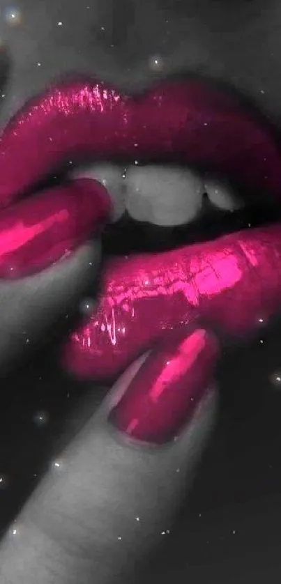 Stylish pink lips and glossy nails on a dramatic black background.
