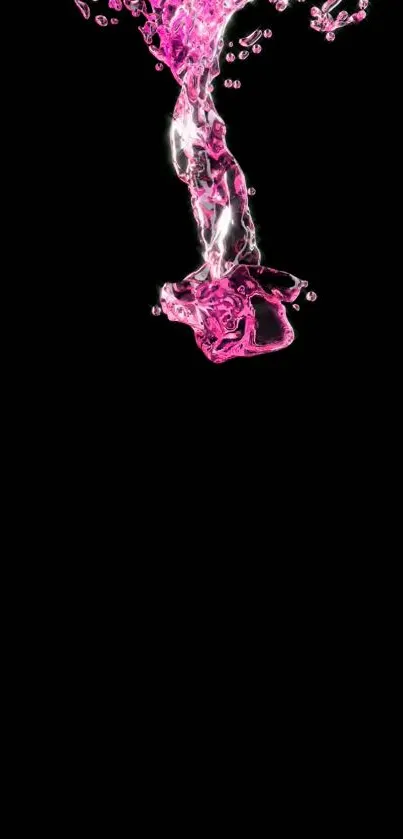 Vibrant pink liquid splash on a black background.