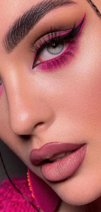 Close-up of vibrant pink makeup on a face.