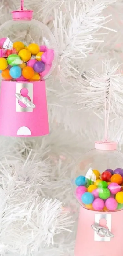 Pink gumball machine ornaments on a white tree.