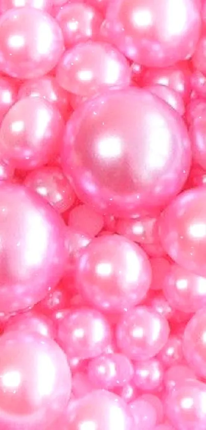 Pink pearls wallpaper with glossy, vibrant spheres.