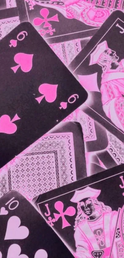 Vibrant pink playing cards on black background wallpaper.