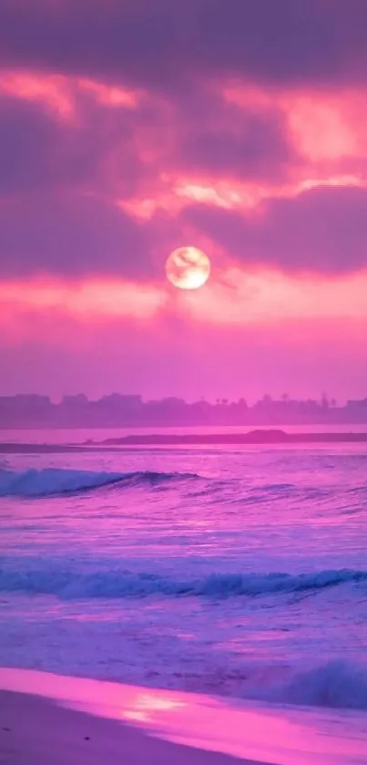 Pink sunset over ocean waves with vibrant sky.