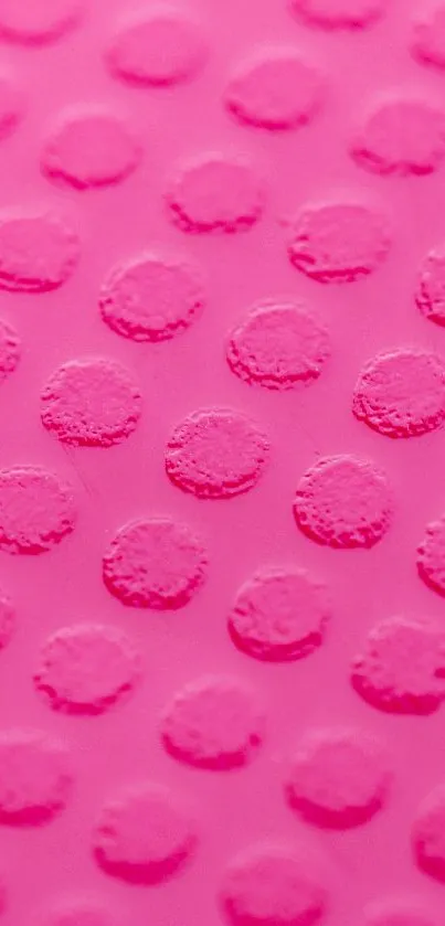 Vibrant pink wallpaper with textured dotted pattern.