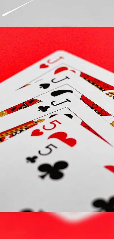 Playing cards on a red background with a bold artistic style.