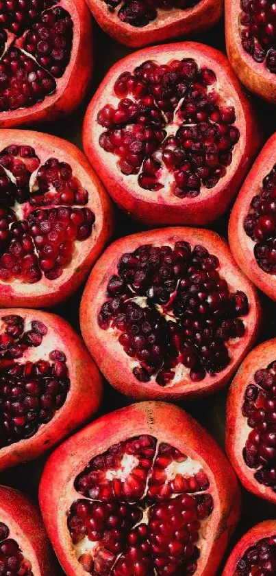 Close-up of vibrant red pomegranates with rich seeds in a pattern.