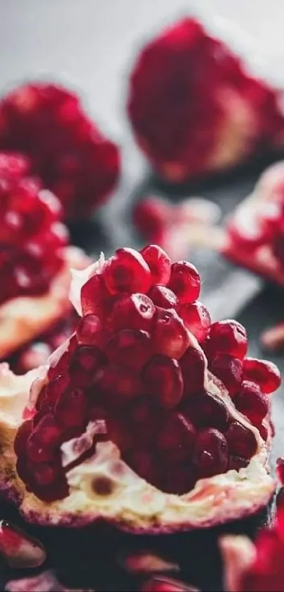 Close-up of vibrant red pomegranate seeds scattered artistically.