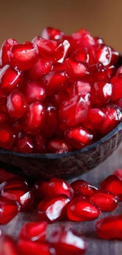 Close-up of vibrant red pomegranate seeds overflowing from a bowl.