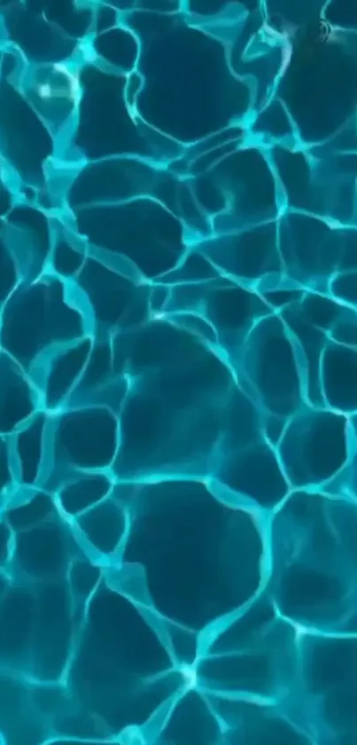 Rippling teal pool water creating vibrant patterns.
