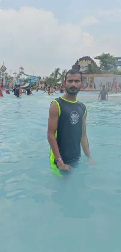 Man enjoying a pool day at a bustling waterpark.