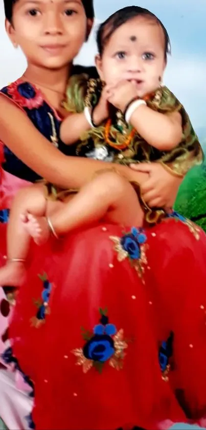 Two children in colorful attire with a serene background.