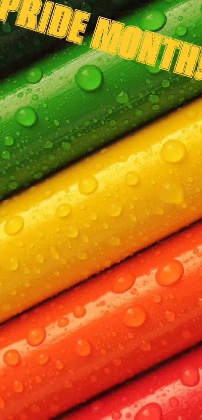 Vibrant pride month rainbow wallpaper with colorful droplets on green background.