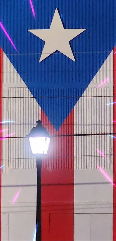 Puerto Rican flag mural with streetlight and festive lights.