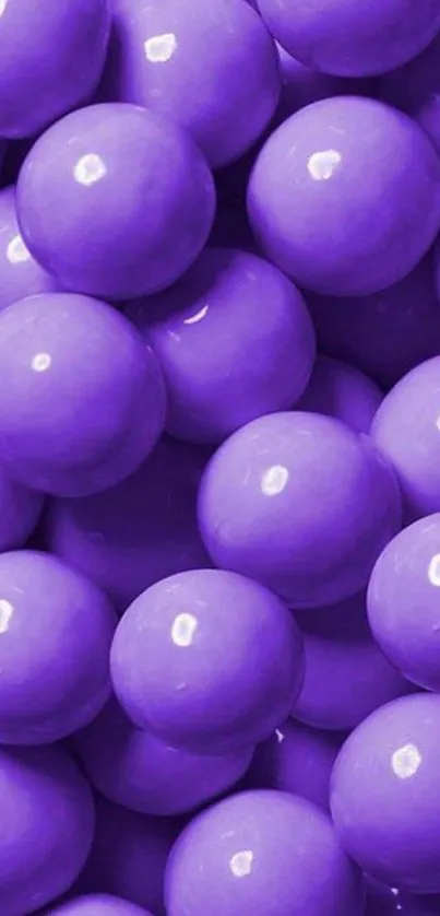 Purple candy balls create a vibrant mobile wallpaper design.