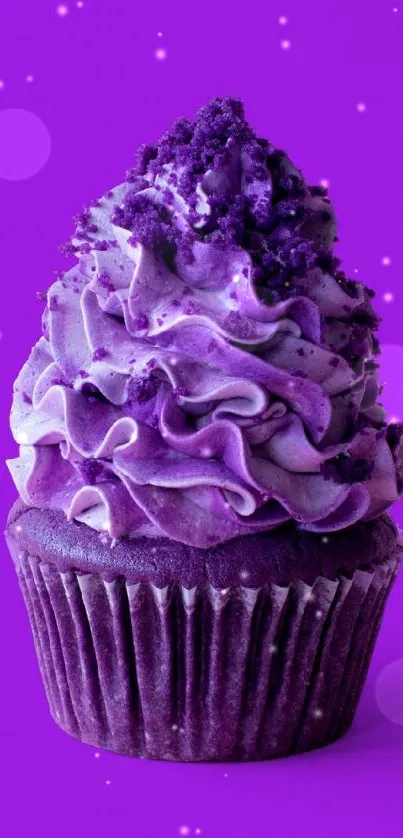 Vibrant purple cupcake with intricate frosting design.