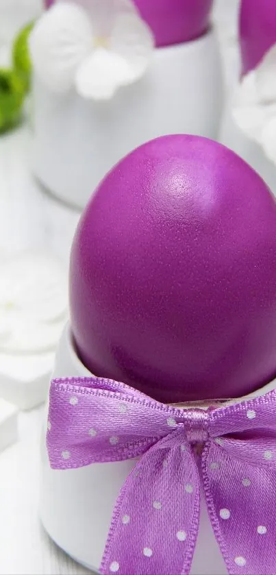 Purple Easter egg with flowers and ribbons in elegant setting.