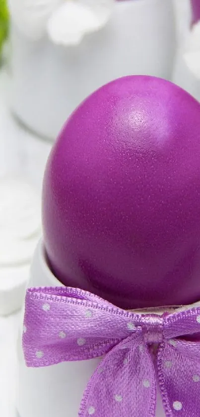 Purple Easter egg with dotted ribbon in elegant display.