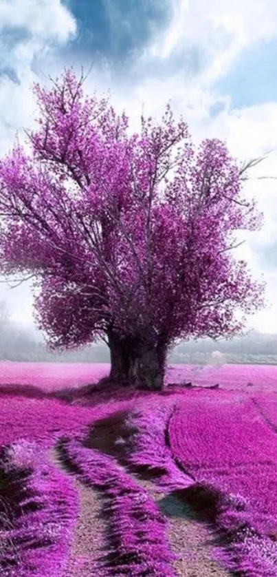 Vibrant purple tree and field under a bright blue sky.