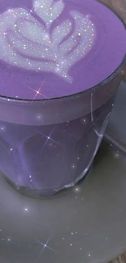 Vibrant purple latte in a glass cup on wooden surface.