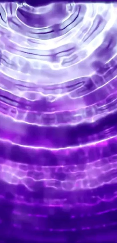 Vibrant purple wallpaper with ripple effect and luminous wave patterns.