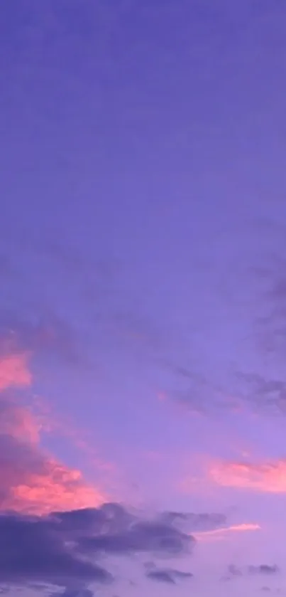 Purple sky with pink clouds at sunset.