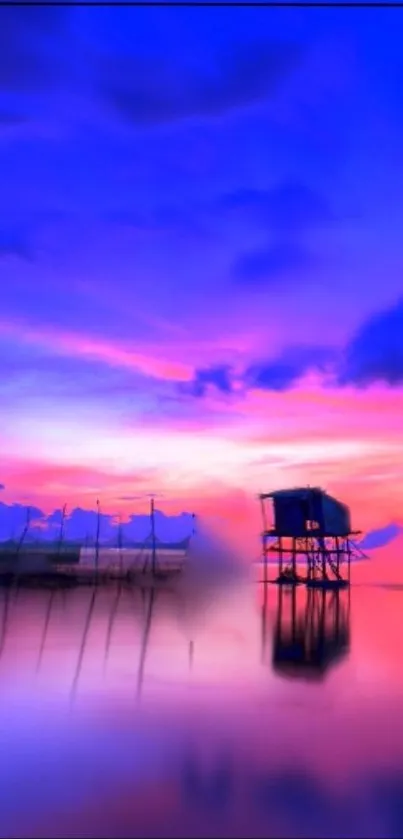 Vibrant purple sunset over calm water with colorful reflections.