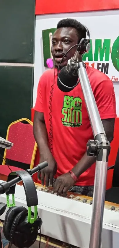 Radio host with headphones in vibrant studio setting.