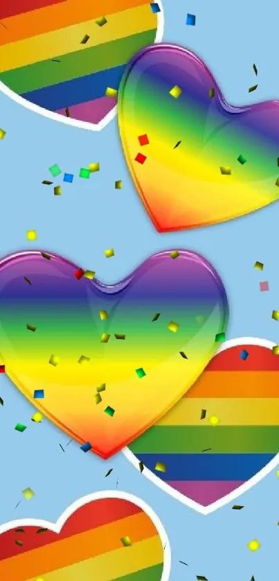 Rainbow hearts on light blue wallpaper background.