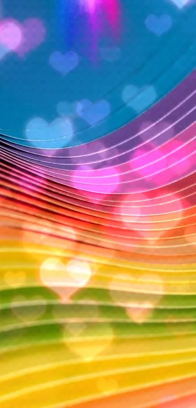 Colorful rainbow wallpaper with heart patterns and vibrant light effects.