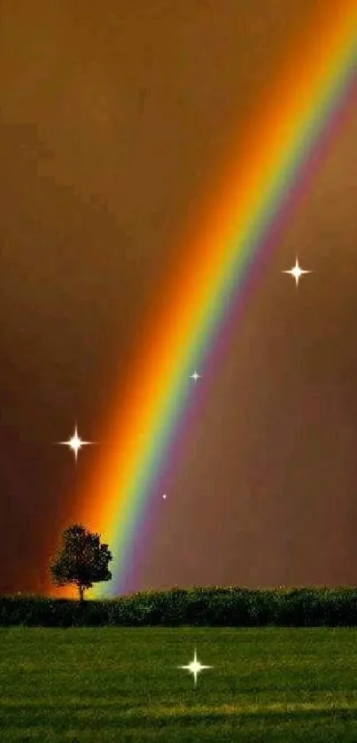 Vibrant rainbow arcs above a lush green field under a dark orange sky.