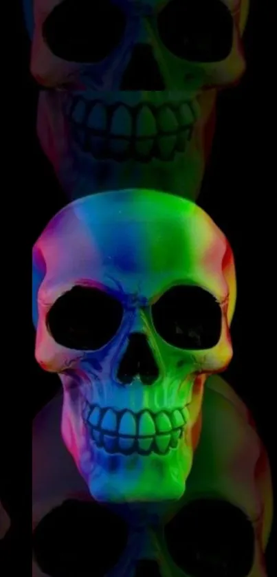 Vibrant neon rainbow skull on black background mobile wallpaper.