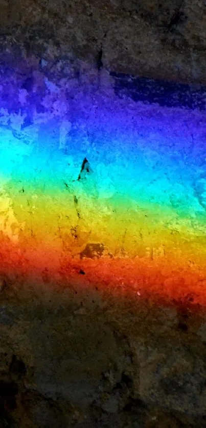 Vibrant rainbow against a textured stone background for mobile wallpaper.